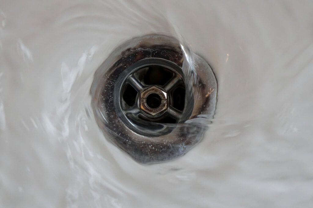 Water going down the plug hole of a bathtub