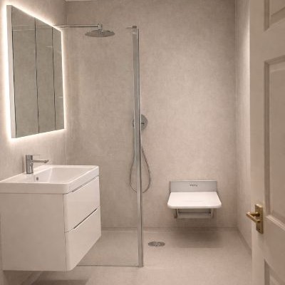 Beige-accessible-wet-room-with-shower-seat simple classic neutral accessible wet room with seat