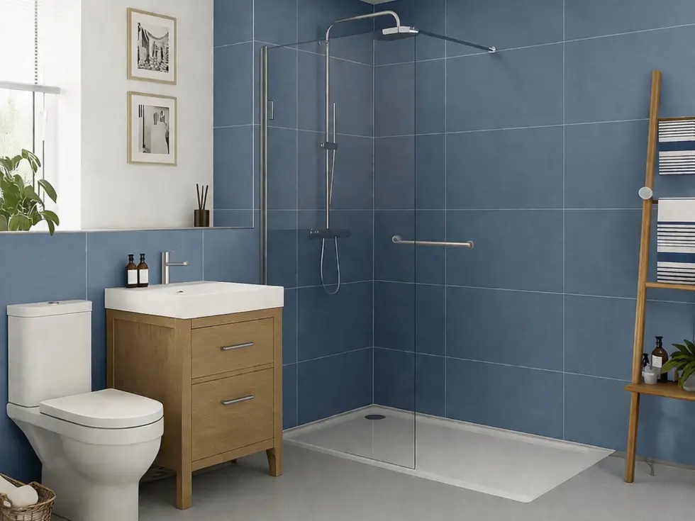 A mobility shower with blue tile-effect wallboards and a low-profile shower tray and anti-slip flooring